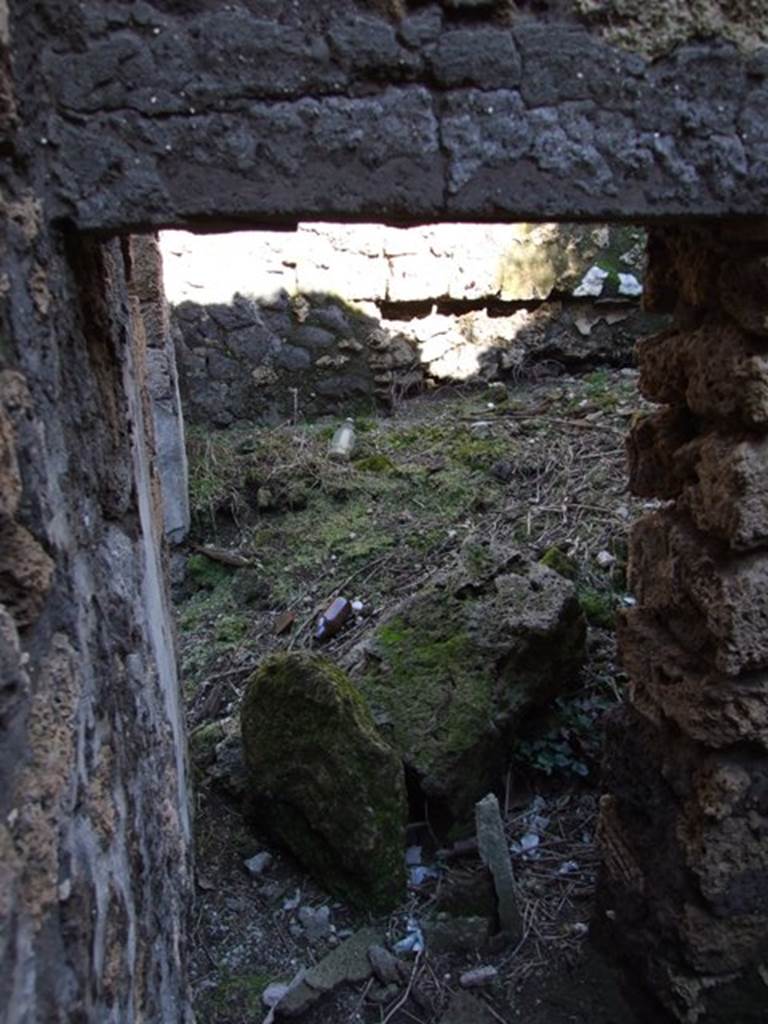 IX.9.13 Pompeii.  March 2009.  Room 8, Small room. Looking east through small doorway linking to Room 7.