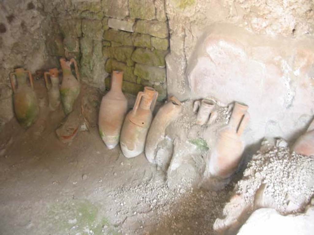 IX.11.2 Pompeii. May 2003. Amphorae against east wall. Photo courtesy of Nicolas Monteix.