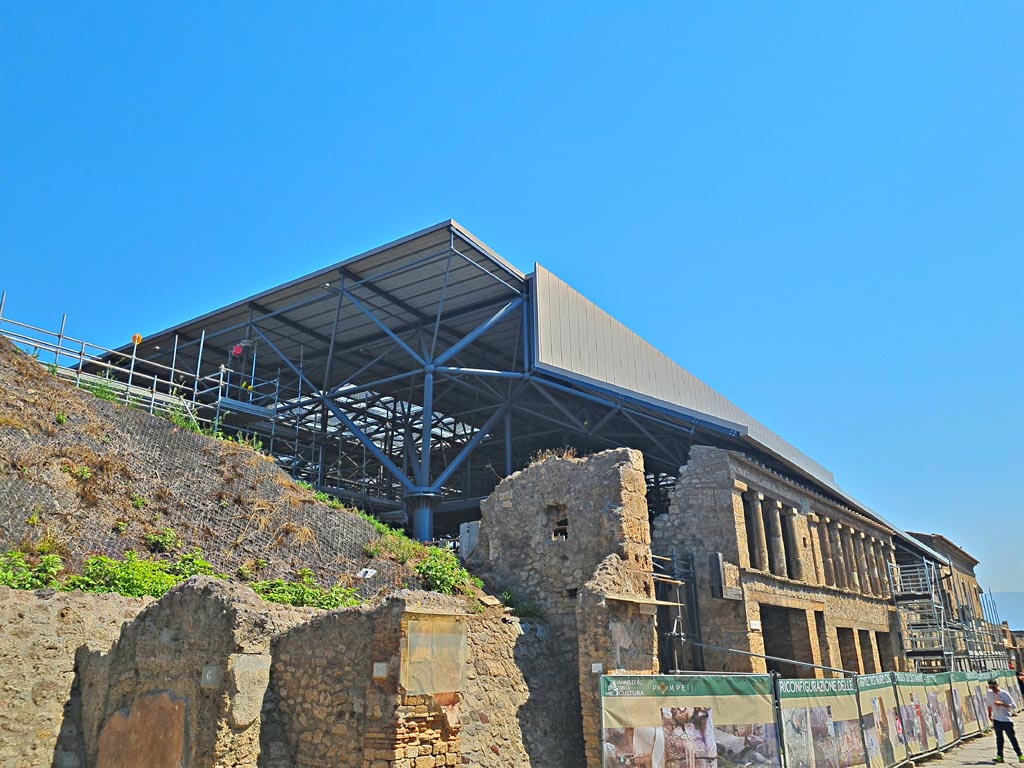 Via dell’Abbondanza, north side, Pompeii. June 2024. IX.11.6/7/8 on left, IX.12, on right. Photo courtesy of Giuseppe Ciaramella.