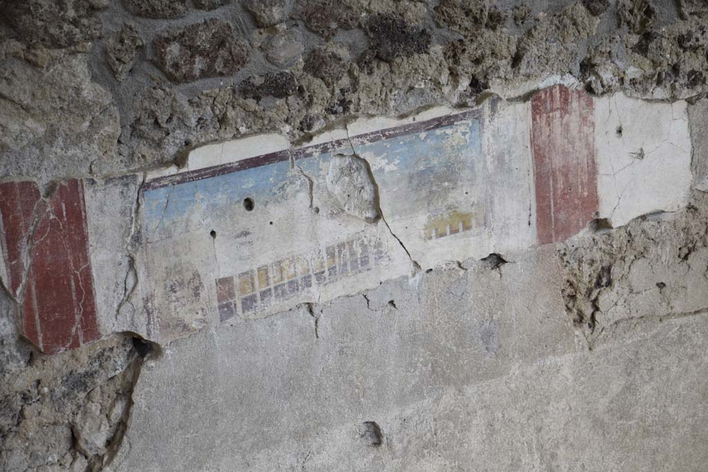 IX.12.4 Pompeii. February 2017. 
Detail of painted east wall in room being excavated, on west side of bakery at IX.12.6. Photo courtesy of Johannes Eber.

