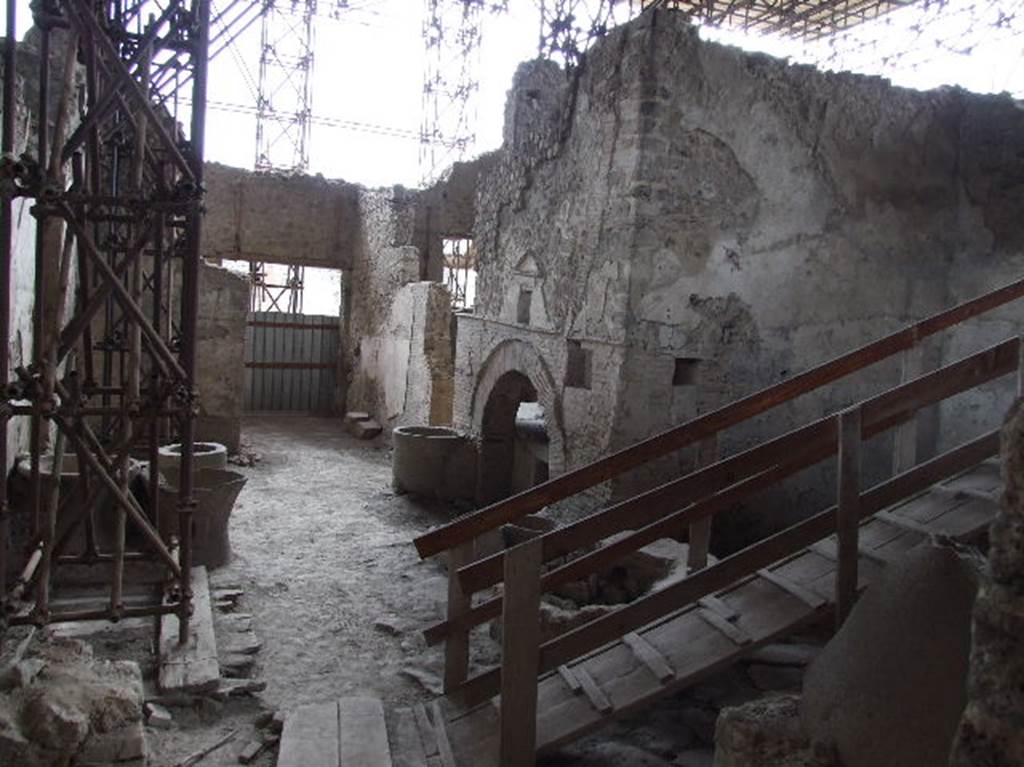 IX.12.6 Pompeii. December 2006. Looking south across the bakery room “e”, from room “f”. 