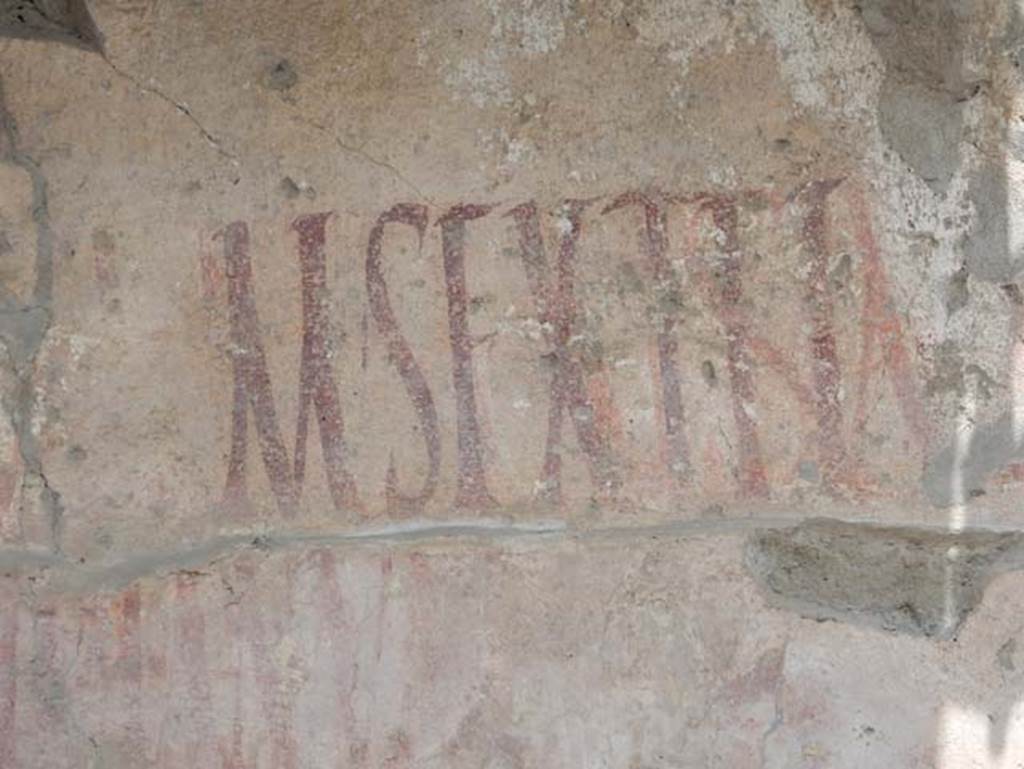 IX.12.7, Pompeii, May 2018. Detail of graffiti on west side of window. Photo courtesy of Buzz Ferebee.

