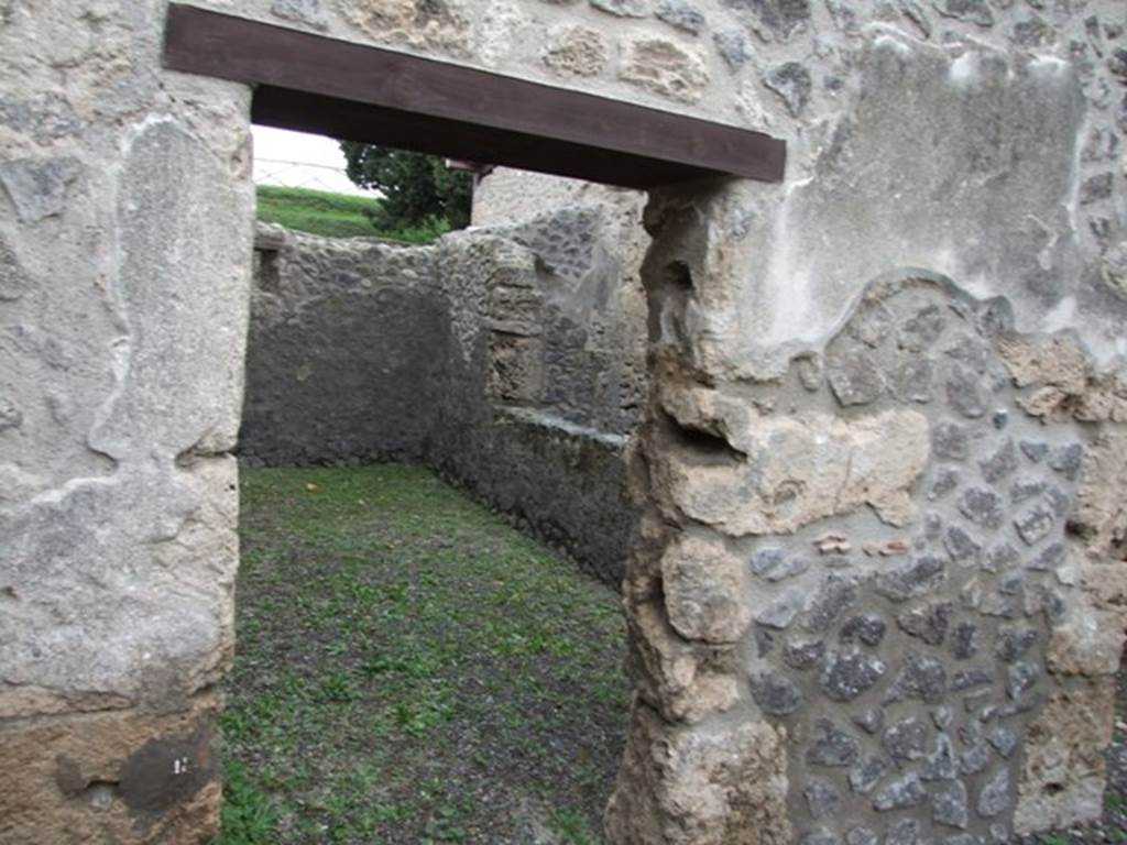 IX.14.4 Pompeii. December 2007. Doorway to room 7,  in south-east corner, next to room with latrine.   