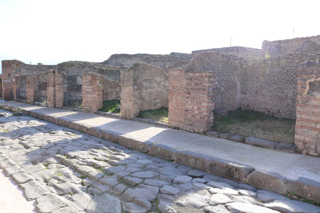 Via Stabiana, west side, Pompeii. December 2018. 
Looking south from VII.3.18, on right, towards VII.3.23, on left. Photo courtesy of Aude Durand.
