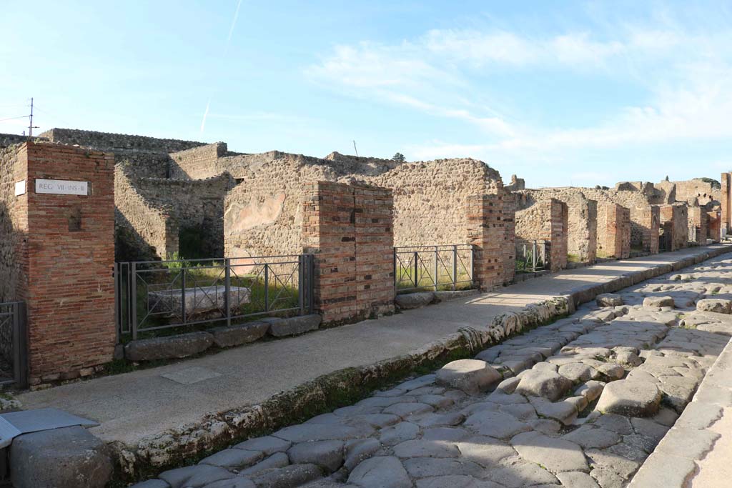 Via Stabiana, west side, Pompeii. December 2018. 
Looking north from junction with Vicolo del Panettiere, on left, from VII.3.23 to VII.3.15, on right. Photo courtesy of Aude Durand.
