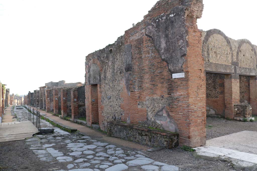 Via degli Augustali, south side, Pompeii. December 2018. Looking towards junction with Forum, on right. Photo courtesy of Aude Durand.