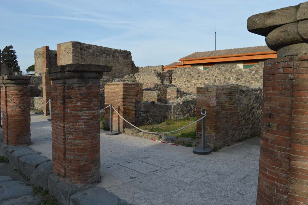 Via del Foro, east side, Pompeii. March 2019. 
Looking north-east from fourth pilaster/column, on right, towards VII.4.7, and fifth and sixth pilaster/columns. 
Foto Taylor Lauritsen, ERC Grant 681269 DCOR.
