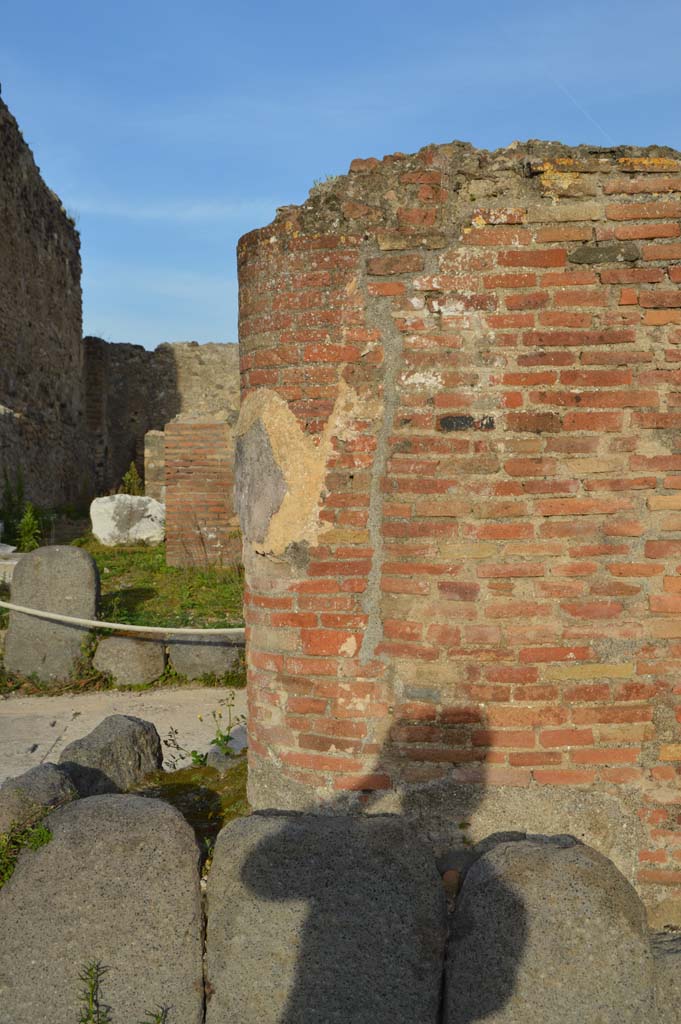 Via del Foro, east side, Pompeii. March 2019. 
Looking east towards base of pilaster/column at northern end.
Foto Taylor Lauritsen, ERC Grant 681269 DCOR.
