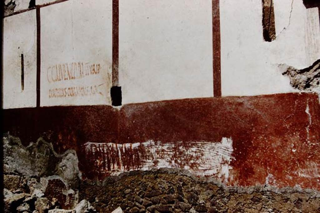 Vicolo di Ifigenia, east side, Pompeii. 1961. Exterior wall between entrances III.4.e, on left, and III.4.d, on right.  Photo by Stanley A. Jashemski.
Source: The Wilhelmina and Stanley A. Jashemski archive in the University of Maryland Library, Special Collections (See collection page) and made available under the Creative Commons Attribution-Non Commercial License v.4. See Licence and use details.
J61f0555
