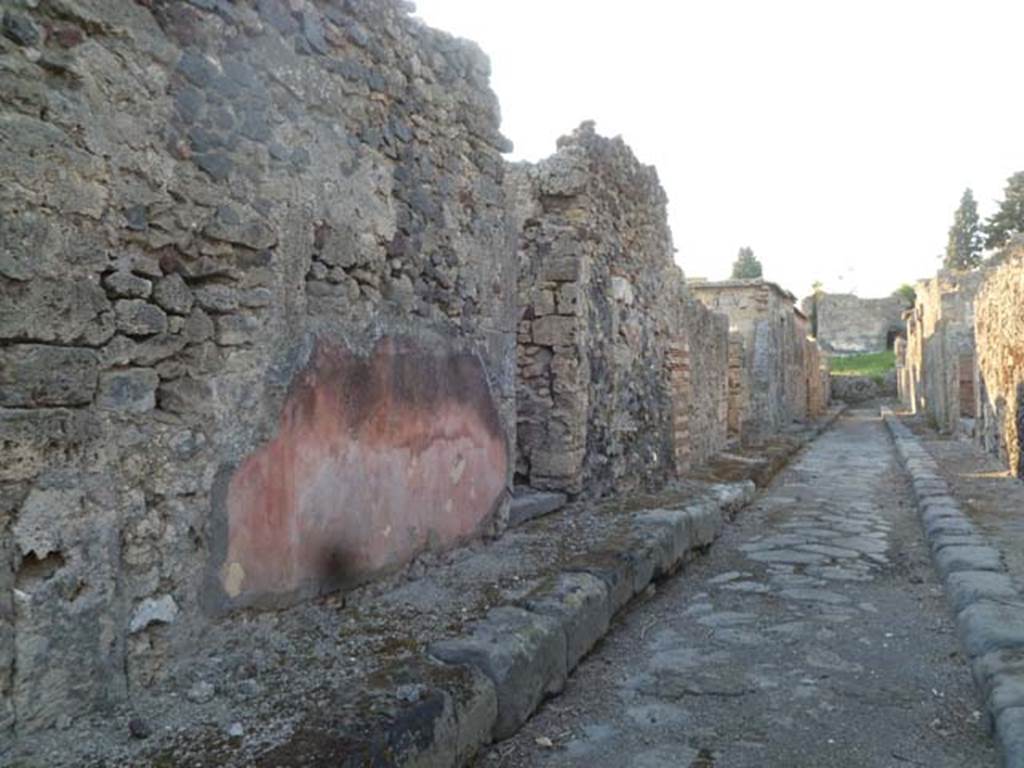 Vicolo di Modesto, May 2011. Looking north-west along west side, from outside VI.2.25. 