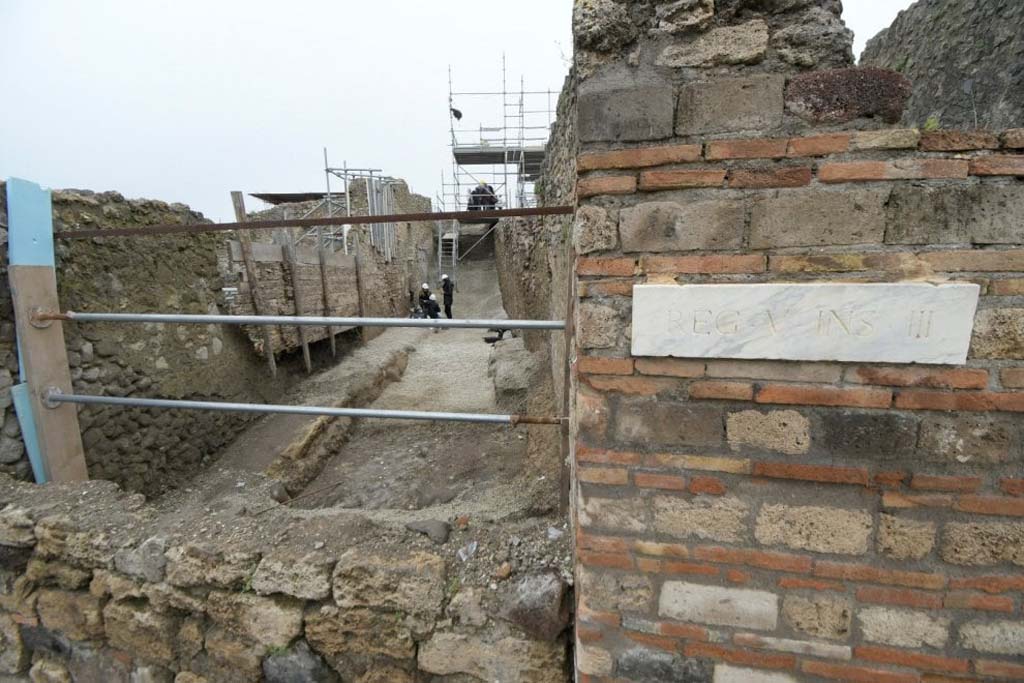 Vicolo delle Nozze Argento, at junction with Vicolo dei Balconi. Three electoral inscriptions at north-west corner of junction.

On the East wall are two inscriptions:

In black above is the inscription

HELVIUM SABINUM
AEDILEM D R P V B O V F

Helvium Sabinum
aedilem d(ignum) r(ei) p(ublicae)
v(irum) b(onum) o(ro) v(os)
f(aciatis)

In red below is the inscription:

ALBVCIVM AED

Electoral inscription on the south wall: 

L ALBVCIVM AED

L(ucium) Albucium aed(ilem). 

The Albucii were probably the owners of the House of the Silver Wedding.
The inscriptions were made on a layer of white paint, perhaps done to cover previous inscriptions and in any case to ensure a clear writing surface for the preserved inscriptions, which refer to the last electoral campaign of Pompeii before 79AD.
Photograph © Parco Archeologico di Pompei.