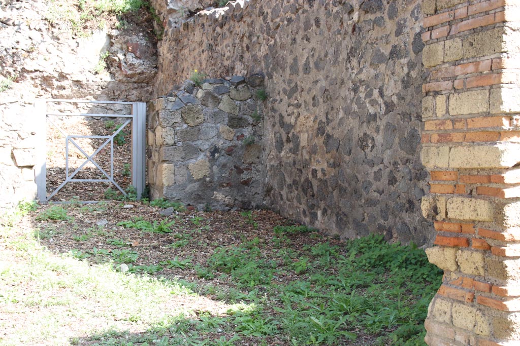 HGE26 Pompeii. October 2023. 
Doorway to rear room in east wall, with south-east corner and south wall of shop-room. Photo courtesy of Klaus Heese.
