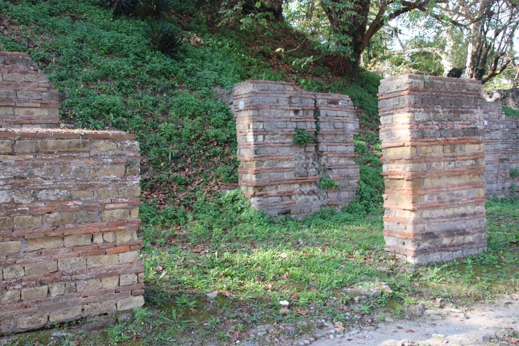 HGW12 Pompeii. October 2023. Looking north-west towards portico with shop doorway, at rear. Photo courtesy of Klaus Heese.