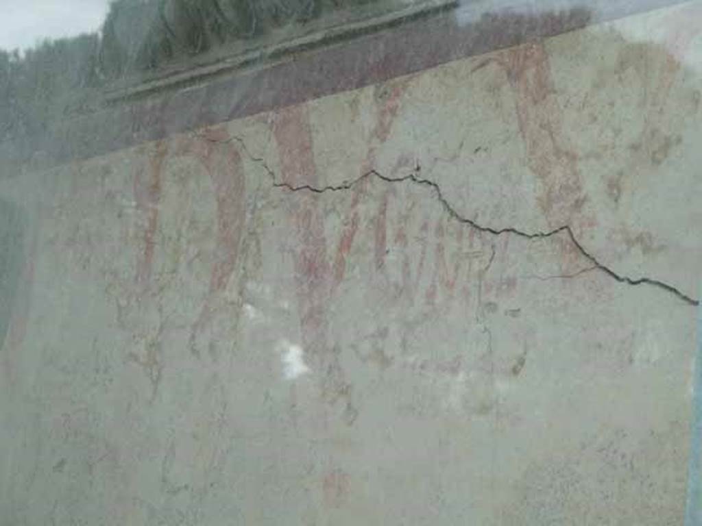 Pompeii Porta Nocera. Tomb 9ES.  May 2010. Painted graffiti on east side of entrance doorway.