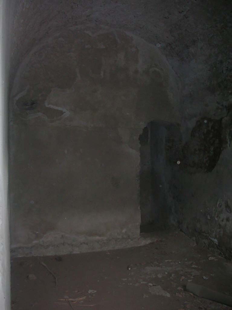 Tower XI, Pompeii. May 2010. 
South-west corner of lower room, and arched doorway. Photo courtesy of Ivo van der Graaff.

