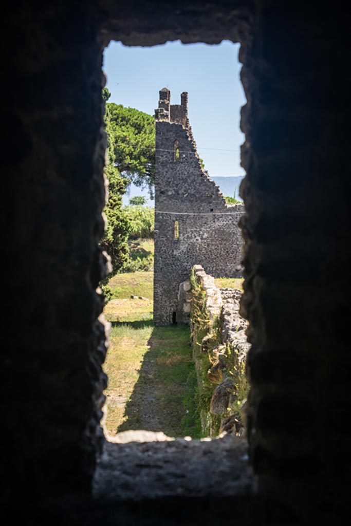 Tower XI, Pompeii. August 2023. 
Looking through window in north-east corner along Walls towards Tower X. Photo courtesy of Johannes Eber.
