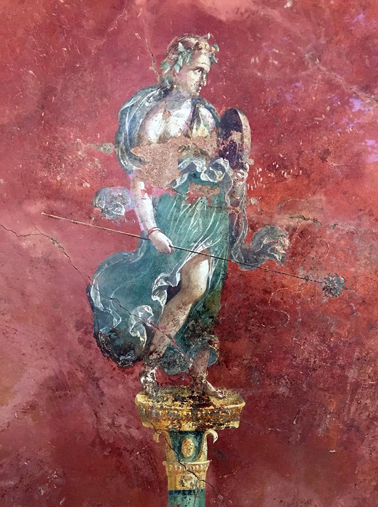 Complesso dei triclini in località Moregine a Pompei. September 2015.
Triclinium C, east wall on display in Pompeii Palaestra. 
Figure dressed in green, possibly Polyhymnia the muse of hymns and sacred poetry, or perhaps a maenad with bacchic attributes.

