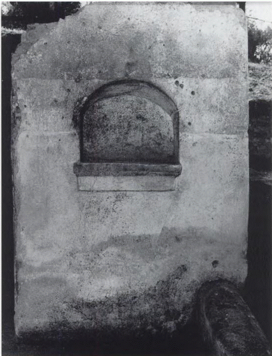 53. Scafati, Villa N. Popidi Narcissi Maioris. Arched niche lararium on west wall in room 8.
Nella parete O lo zoccolo di intonaco raggiunge un’altezza di m. 1,24 ed in essa si apre un larario (largh. 0,55; alt. 0,47; prof. M. 0,33; posto a m. 1,05 dal piano pavimentale) con il piano costituito da una tegola fratta a sua volta rivestita da intonaco. L’intonaco sottostante presenta diciotto linee verticale incise (Alte da m. 0,04 a m. 0,055).
On the west wall the plaster base reaches a height of m. 1.24 and in it opens a lararium (width 0.55; height 0.47; depth 0.33 m; located 1.05 m from the floor level) with the base made of a broken tile in turn covered with plaster. The underlying plaster has eighteen engraved vertical lines (0.04 to 0.055 m high).
See Conticello de' Spagnolis, M., 2002. La villa "N. Popidi Narcissi Maioris": in Scafati, suburbio orientale di Pompei, p. 73, fig. 49.

Nel vano (9) ricavato nel portico (8) fu edificata una nicchia (h. 47; largh. 55; prof. 33; h. dal suolo 105) con piano costituito da una tegola con, al di sotto, una cornice aggettante. La parete sottostante presenta intonaco decorato con diciotto linee verticale incise.
In the room (9) created in the portico (8) a niche was built (h. 47; width 55; depth 33; height from the ground 105) with a surface made of a tile with, below, a protruding frame. The wall below has plaster decorated with eighteen engraved vertical lines.
See Giacobello, F., 2008. Larari Pompeiani: Iconografia e culto dei Lari in ambito domestico. Milano: LED Edizioni, (p.223, no.5)

