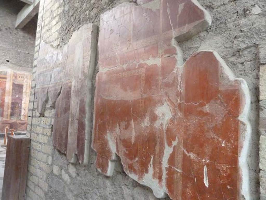 Oplontis, September 2015. Corridor on east side of south side of atrium, north wall with painted decoration. Room 5, the atrium, can be seen on the left.
