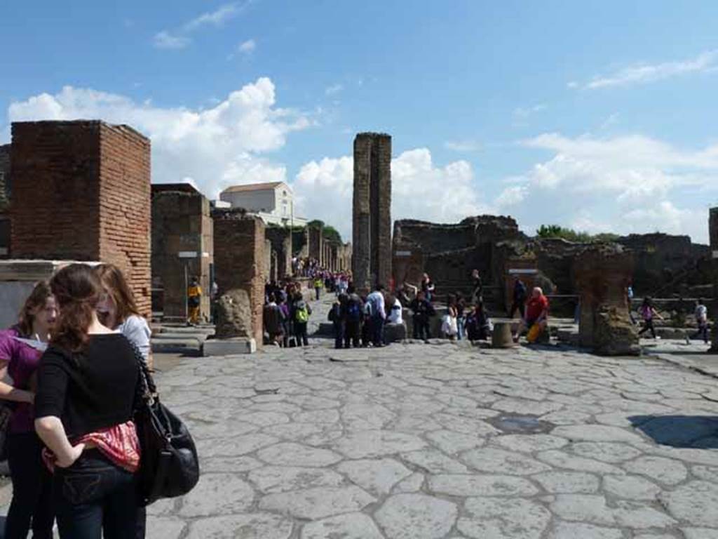 Arch of Marcus Holconius Rufus. May 2010. Site of arch at Holconius crossroads.
This was a large arch at the major crossroads of Via dellAbbondanza and Via Stabiana 
Looking east along Via dellAbbondanza to junction with Via Stabiana.
According to Liselotte Eschebach this is a Tetrapylon.
See Eschebach, L., 1993. Gebudeverzeichnis und Stadtplan der antiken Stadt Pompeji. Kln: Bhlau. (Pages 244-5).
According to Wikipedia, A tetrapylon (Greek: Τετράπυλον, "four gates") is an ancient type of Roman monument of cubic shape, with a gate on each of the four sides: generally it was built on a crossroads.
