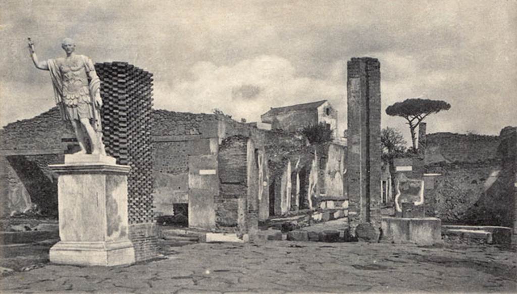 Arch of Marcus Holconius Rufus. About 1900. Statue of Marcus Holconius Rufus in situ showing restoration work on pillar of arch behind. Photo courtesy of Drew Baker.