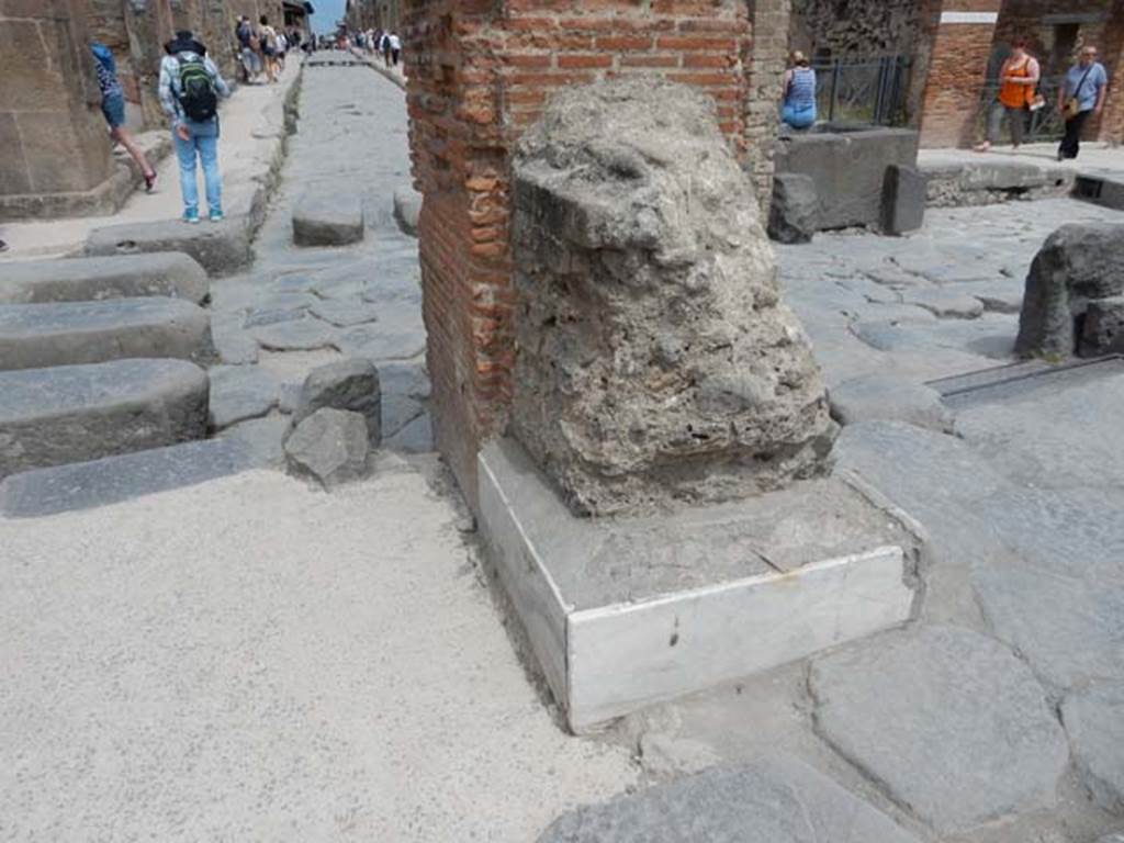 Arch of Marcus Holconius Rufus. May 2017. North-east pillar with remains of another statue base. Looking east along Via dellAbbondanza from junction with Via Stabiana. Photo courtesy of Buzz Ferebee.

