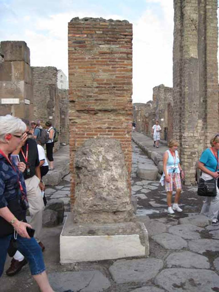 Arch of Marcus Holconius Rufus. September 2010. North-east pillar, west side. One of the four pillars supporting the arch. Photo courtesy of Drew Baker. According to Liselotte Eschebach, two statue bases had inscriptions. The second was to Holconia who was a priestess of Ceres. See Eschebach, L., 1993. Gebudeverzeichnis und Stadtplan der antiken Stadt Pompeji. Kln: Bhlau. (Pages 244-5). According to Cooley, the inscription accompanied an honorific statue to Holconia, which was probably part of the arch honouring her family. The inscription was To Holconia, daughter of Marcus, public priestess. See Cooley, A. and M.G.L., 2004. Pompeii : A Sourcebook. London : Routledge. (Page 101, E48). CIL X 950/1.